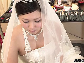 Black-hearted Emi Koizumi fucked on wedding rags uncensored.